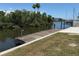Waterfront property featuring a private dock, mature landscaping and canal access for boating at 808 25Th W Ave, Palmetto, FL 34221