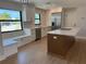 Modern kitchen featuring a large island, stainless steel appliances, and built-in window seating at 808 25Th W Ave, Palmetto, FL 34221