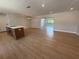 Open-concept living space with hardwood flooring, recessed lighting, and a clear view to other rooms at 808 25Th W Ave, Palmetto, FL 34221