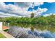Stunning water view from the dock surrounded by lush trees and mangroves at 808 25Th W Ave, Palmetto, FL 34221