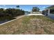 Backyard that leads to the waterfront with a private dock, perfect for enjoying the views at 808 25Th W Ave, Palmetto, FL 34221