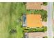 Aerial view highlighting the home's tile roof and backyard pool and spa nestled in a well-maintained community at 8206 Heritage Grand Pl, Bradenton, FL 34212