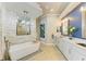 Luxurious bathroom featuring a freestanding tub, dual vanities, and modern fixtures at 8206 Heritage Grand Pl, Bradenton, FL 34212