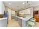 Bright kitchen featuring white and gray cabinetry, quartz countertops, and stainless steel appliances at 8206 Heritage Grand Pl, Bradenton, FL 34212