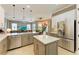 Spacious kitchen featuring white and gray cabinets, a large island, and stainless steel appliances at 8206 Heritage Grand Pl, Bradenton, FL 34212