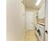 Functional laundry room with white cabinets and washer and dryer at 8206 Heritage Grand Pl, Bradenton, FL 34212