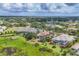An aerial view of a neighborhood featuring beautiful homes, pools, and green landscaping at 8312 Catamaran Cir, Lakewood Ranch, FL 34202