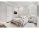 Bright bedroom with a fluffy rug, light-colored walls, and built-in nightstand at 8312 Catamaran Cir, Lakewood Ranch, FL 34202