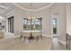 Cozy dining area featuring a bay window with views of the pool and outdoor living space at 8312 Catamaran Cir, Lakewood Ranch, FL 34202
