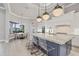 Gourmet kitchen with eat-in area overlooking the pool, a large island, and stainless appliances at 8312 Catamaran Cir, Lakewood Ranch, FL 34202