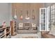 Stylish living room features guitar display, media console, and access to outdoor living at 8312 Catamaran Cir, Lakewood Ranch, FL 34202