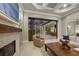 Bright living area with tiled fireplace, comfortable furnishings and a great view of the pool area at 8312 Catamaran Cir, Lakewood Ranch, FL 34202