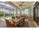 Outdoor dining space with seating, grill, and view of the pool at 8312 Catamaran Cir, Lakewood Ranch, FL 34202
