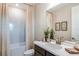 Well-lit bathroom featuring a vanity, mirror, and a bathtub with a shower curtain at 8583 Big Dipper Dr, Sarasota, FL 34241