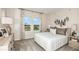 Bright bedroom with two windows, neutral decor, and comfortable furnishings, offering a serene space at 8583 Big Dipper Dr, Sarasota, FL 34241