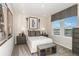 Inviting bedroom with a bed, stylish decor, and a window, offering a peaceful retreat at 8583 Big Dipper Dr, Sarasota, FL 34241