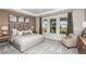 Beautifully furnished bedroom with plush carpets, tray ceiling, lots of pillows and large windows at 8583 Big Dipper Dr, Sarasota, FL 34241