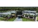 Exterior view of a community center with a pool, fitness center, and beautifully landscaped grounds at 8583 Big Dipper Dr, Sarasota, FL 34241