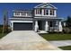 Charming two-story home with manicured lawn, inviting porch and a two car garage at 8583 Big Dipper Dr, Sarasota, FL 34241