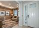Inviting foyer area with a view into the office and featuring a modern front door at 8583 Big Dipper Dr, Sarasota, FL 34241
