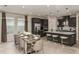 Modern kitchen with dining area, stainless steel appliances, and oversized island at 8583 Big Dipper Dr, Sarasota, FL 34241