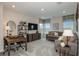 Bright living room with comfortable seating, a desk, and a media center, perfect for relaxation or work at 8583 Big Dipper Dr, Sarasota, FL 34241