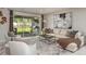 Inviting living room with neutral decor, ample seating, and sliding glass doors to the lanai at 8583 Big Dipper Dr, Sarasota, FL 34241