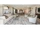 Spacious living room with modern decor and seamless access to the dining and kitchen areas at 8583 Big Dipper Dr, Sarasota, FL 34241