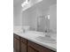Bathroom vanity with double sinks and a large mirror at 8632 Snowfall St, Sarasota, FL 34241