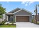 Charming single-Gathering home with a two-car garage, landscaped yard and covered entryway at 8632 Snowfall St, Sarasota, FL 34241