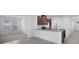 Open-concept kitchen with granite countertops, stainless steel appliances, and an adjoining living area at 8632 Snowfall St, Sarasota, FL 34241