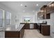 Modern kitchen featuring granite countertops, stainless steel appliances, and a spacious layout at 8632 Snowfall St, Sarasota, FL 34241