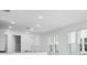 Spacious kitchen with a breakfast bar and large window at 8632 Snowfall St, Sarasota, FL 34241