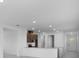 Modern kitchen featuring stainless steel appliances and a breakfast bar at 8632 Snowfall St, Sarasota, FL 34241