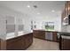 Modern kitchen featuring granite countertops, stainless steel appliances, and a spacious layout at 8632 Snowfall St, Sarasota, FL 34241