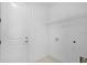 Clean laundry room with new appliances and ample storage space at 8632 Snowfall St, Sarasota, FL 34241