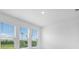 Bright living room with large windows overlooking the backyard at 8632 Snowfall St, Sarasota, FL 34241