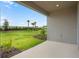 Covered patio overlooking a lush green backyard, perfect for outdoor entertaining at 8632 Snowfall St, Sarasota, FL 34241
