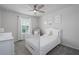 Bedroom with white crib, floral prints, and carpeted floor at 9148 Royal River Cir, Parrish, FL 34219