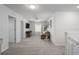Loft area offering versatile space, featuring a ceiling fan, neutral decor, and ample natural light at 9148 Royal River Cir, Parrish, FL 34219