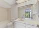 Clean bathroom with vanity, toilet, and tiled shower/tub combination at 933 Sunridge Way # B5, Sarasota, FL 34234