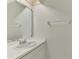 Clean bathroom with sink, vanity, mirror, and towel rack, offering a functional space at 933 Sunridge Way # B5, Sarasota, FL 34234
