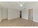 Bedroom with modern floors that leads into the bathroom and closet at 933 Sunridge Way # B5, Sarasota, FL 34234