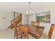 Dining room with a view of the staircase and kitchen at 933 Sunridge Way # B5, Sarasota, FL 34234