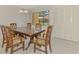 Traditional dining area enhanced by a large window providing a view of the community at 933 Sunridge Way # B5, Sarasota, FL 34234
