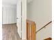 Hallway view with closet and wood-look flooring, showing ample storage at 933 Sunridge Way # B5, Sarasota, FL 34234