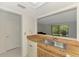 View from the kitchen sink looking out to the living room and lanai at 933 Sunridge Way # B5, Sarasota, FL 34234