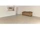Spacious living room featuring neutral tile flooring and a comfortable sofa at 933 Sunridge Way # B5, Sarasota, FL 34234