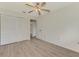 Bright bedroom features a ceiling fan, wood floors and large closet for ample storage at 935 Sunridge Way # B4, Sarasota, FL 34234