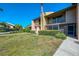 Spacious front lawn, screened in porch, and private balcony at 935 Sunridge Way # B4, Sarasota, FL 34234